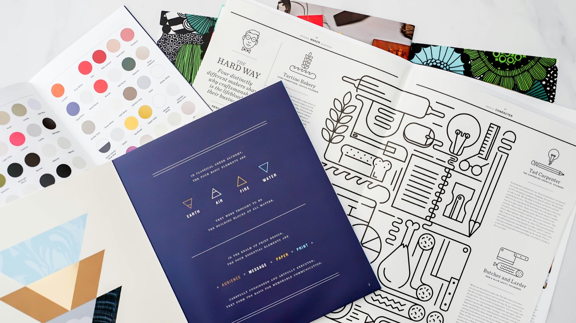 Brand stationery and colour swatches on a desk
